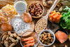 Common foods that may trigger food sensitivity reactions, including dairy, eggs, shellfish, nuts, gluten, and additives.