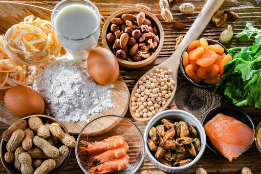 Common foods that may trigger food sensitivity reactions, including dairy, eggs, shellfish, nuts, gluten, and additives.